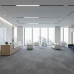 Modern Dubai office lobby featuring textured grey carpet tiles and a city skyline view.