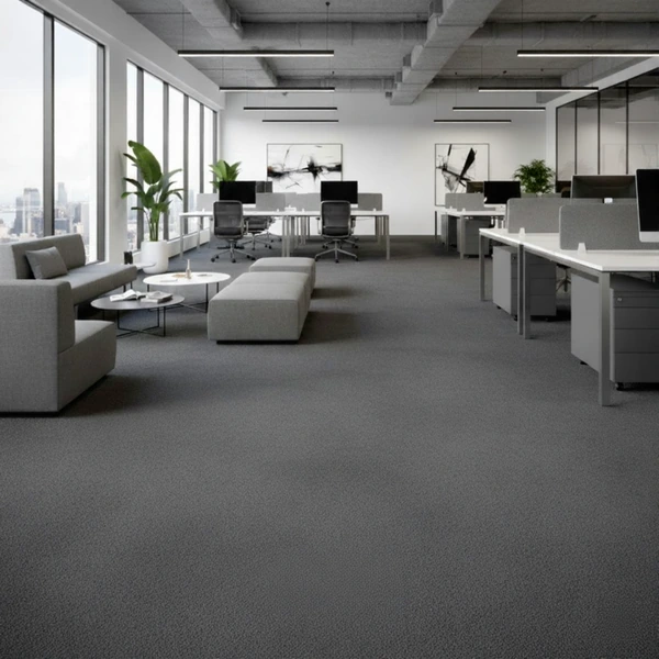 Modern Dubai office with grey fire retardant carpets, sleek workstations, and floor-to-ceiling city views.