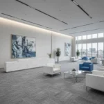 Modern office lobby in Dubai with blue and white seating over a textured grey carpet.
